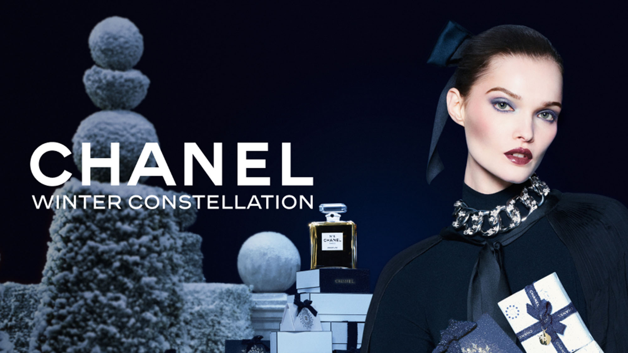 Perfume, serum, and lipstick with radiant background displaying luxury cosmetics.