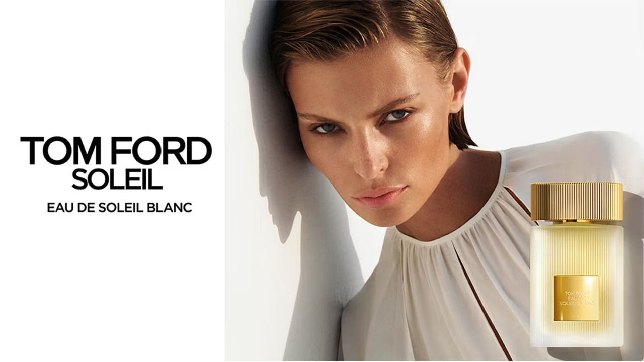 Tom Ford Eau de Soleil Blanc bottle against a sunset backdrop, highlighting luxury and elegance.