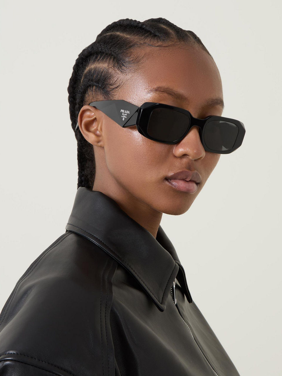 Model wearing Prada sunglasses
