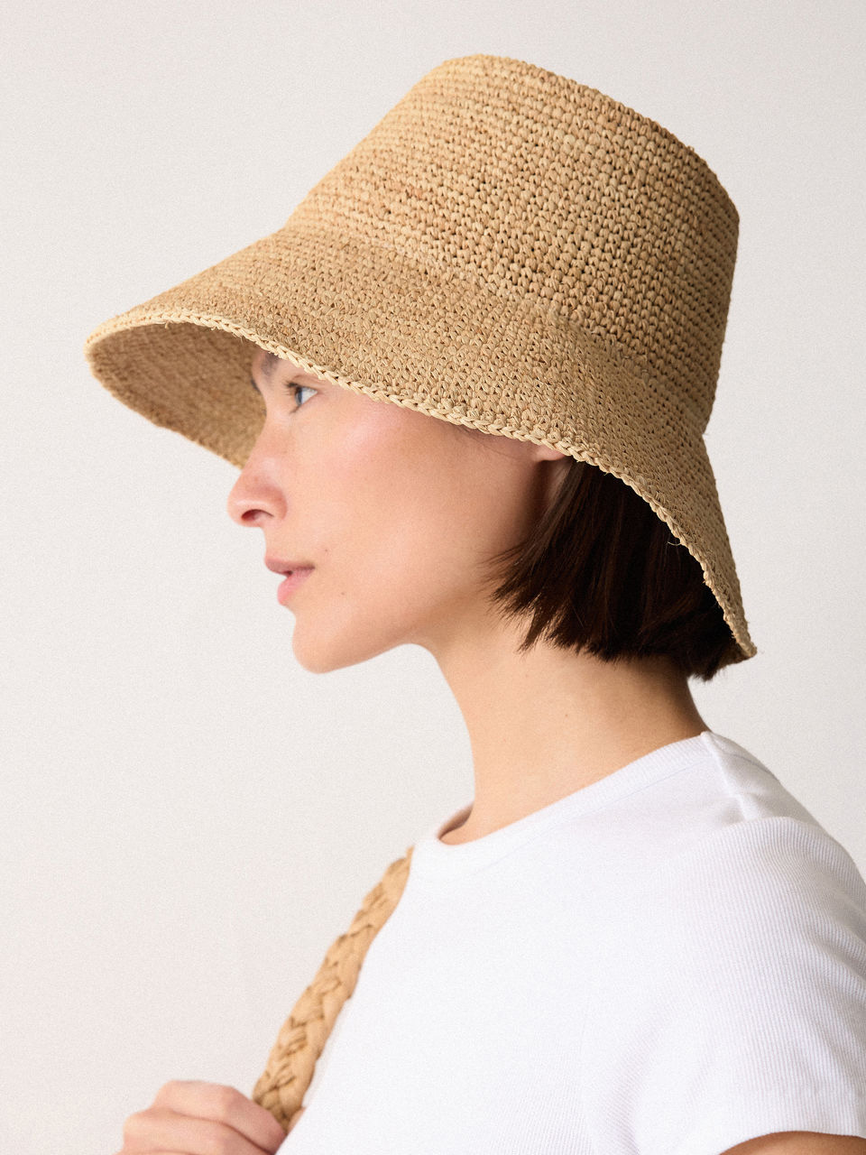 Model wearing woven bucket hat
