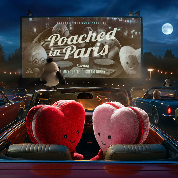 Cute plush characters in a car at a drive-in movie theater watching 'Poached in Paris' under a full moon.