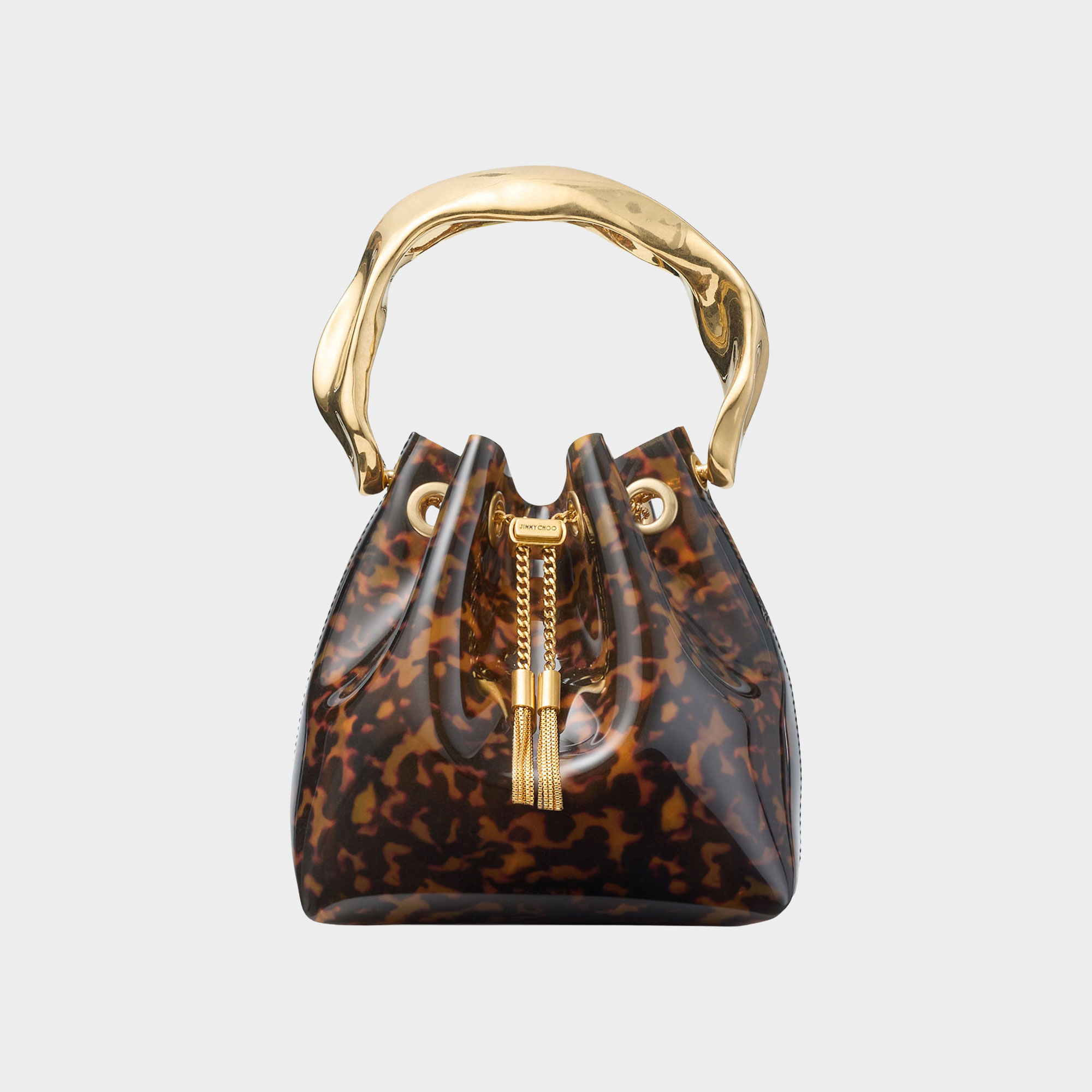 Jimmy Choo Bon Bon Tortoiseshell Bucket Bag in multi, transparent tortoiseshell finish, sculpted gold-tone handle and chain tassel drawstring