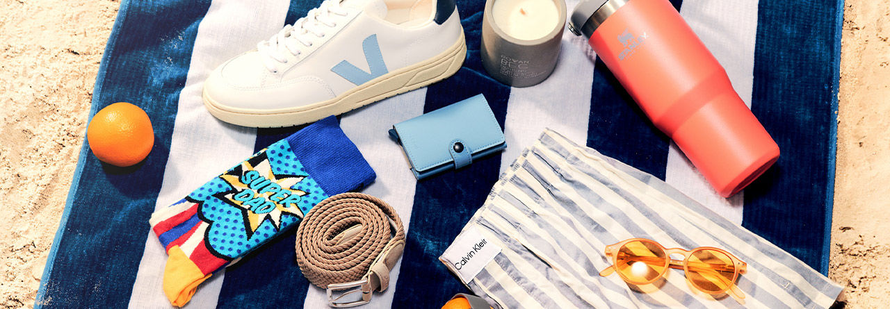 Ralph Lauren cap and Ralph Lauren trainers on grey background