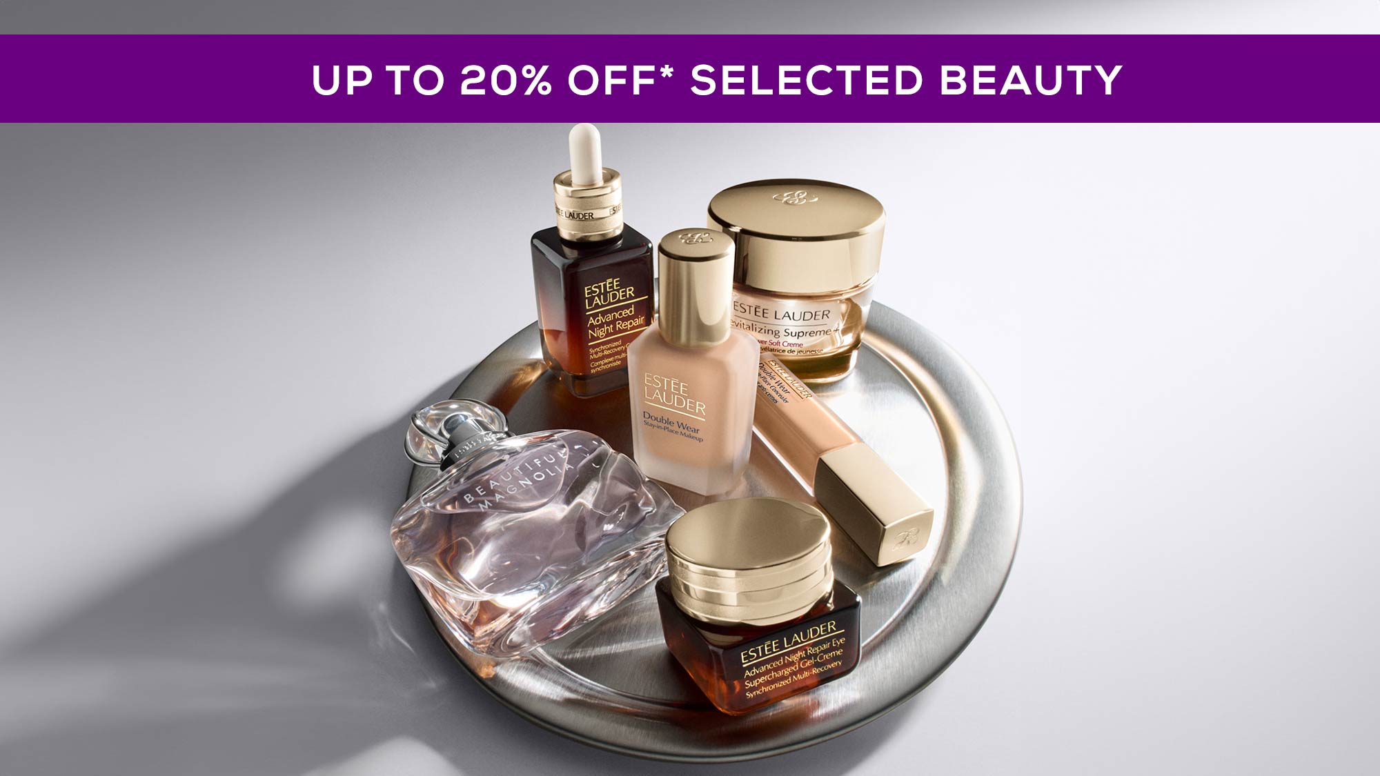 Collection of luxury beauty products including makeup and skincare with purple banner promoting up to 20% off selected beauty brands