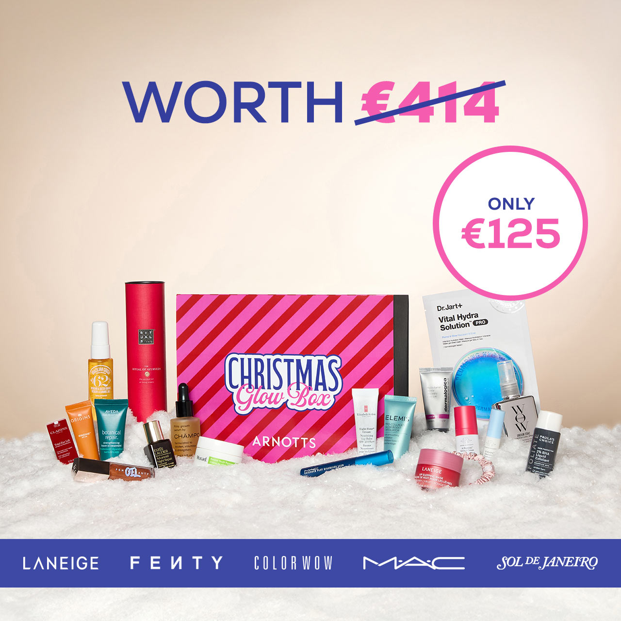 A variety of beauty products are displayed around a 'Christmas Glow Box' valued at €414, now priced at €125. Brands include Laneige, Fenty, and MAC.