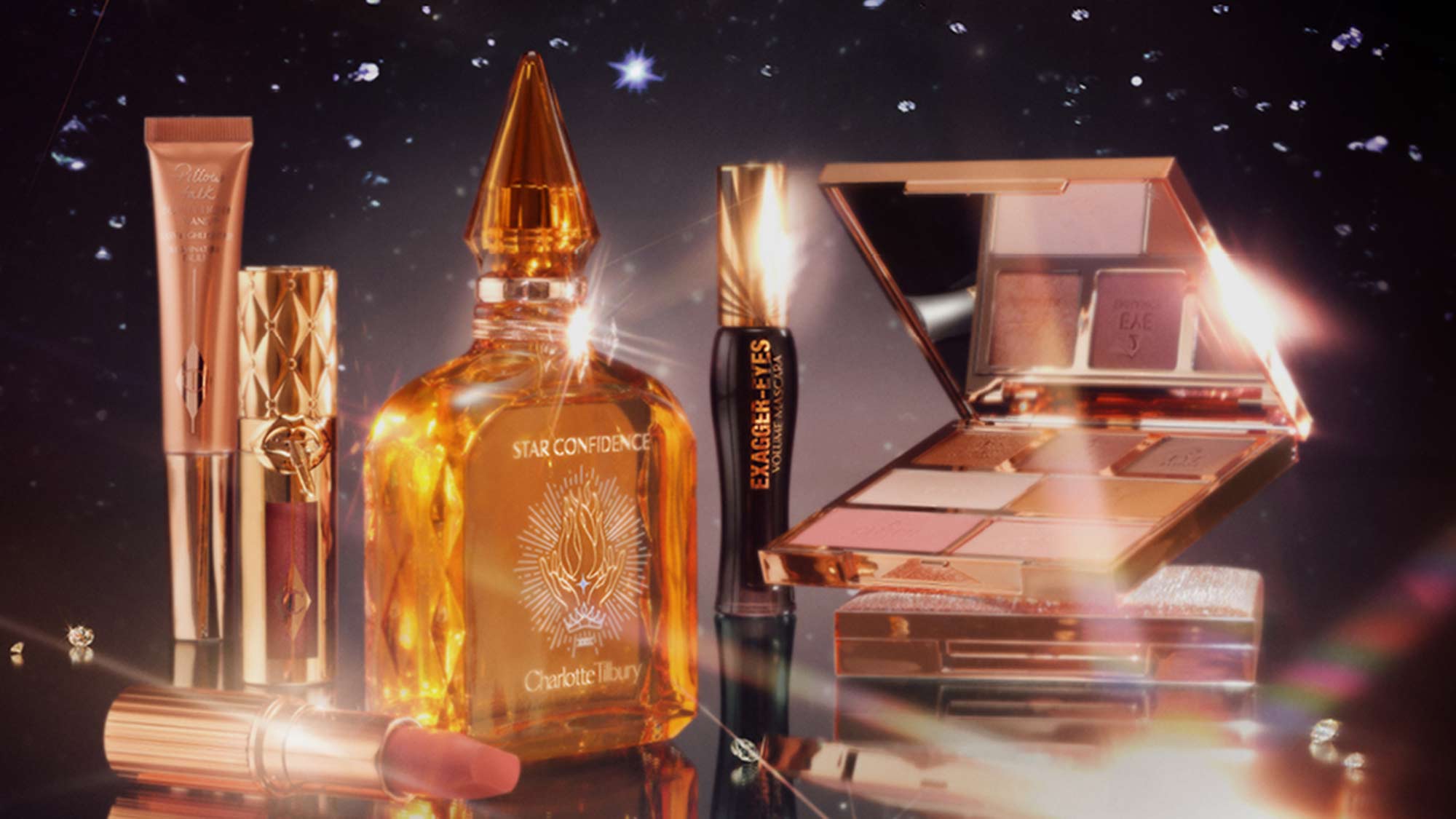 Makeup products, including a perfume bottle and lipstick, are displayed against a starry background with a reflective surface.