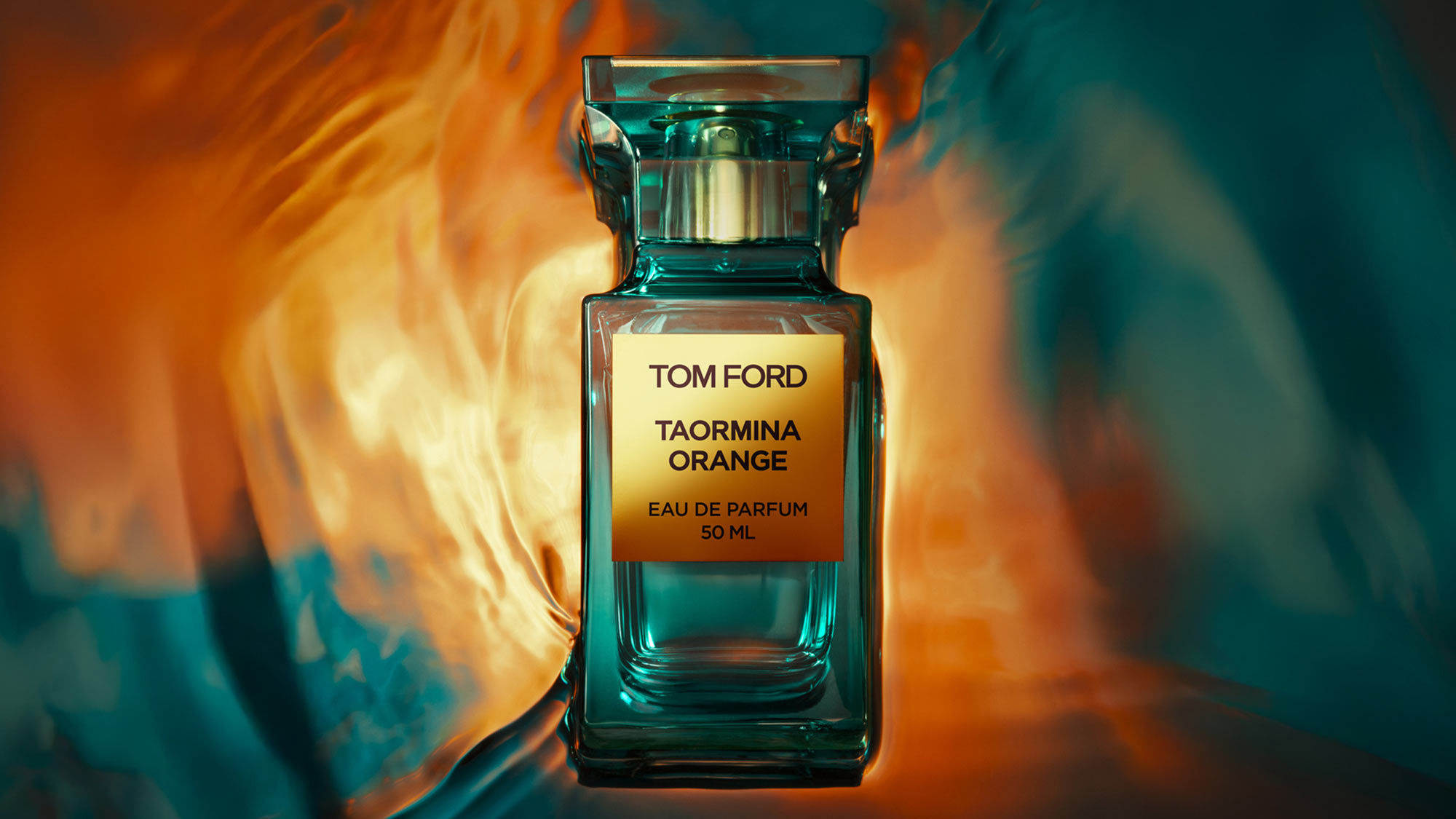 Tom Ford Taormina Orange eau de parfum 50ml bottle with teal glass and gold label against warm orange and teal background
