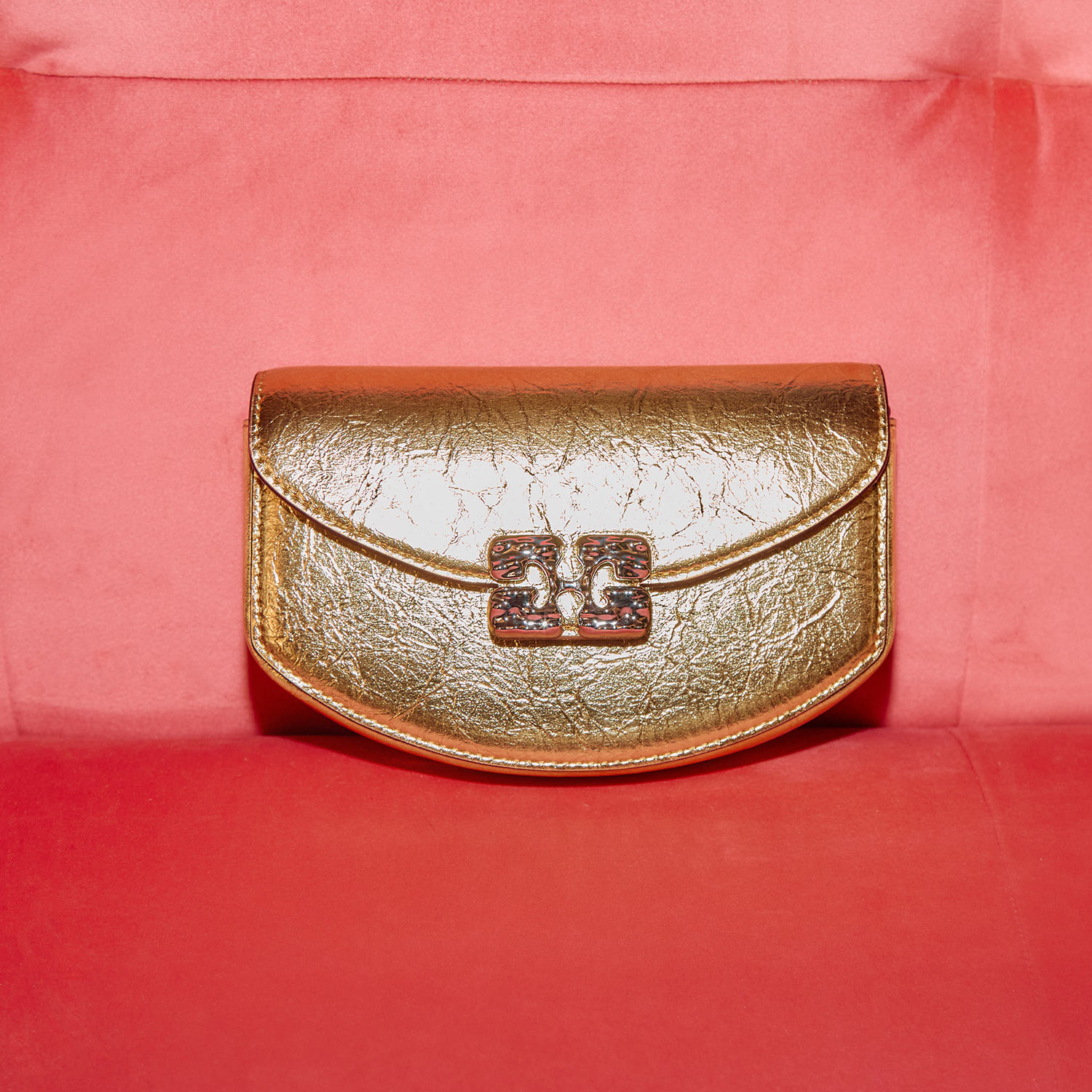 Gold metallic occasion clutch bag with decorative clasp