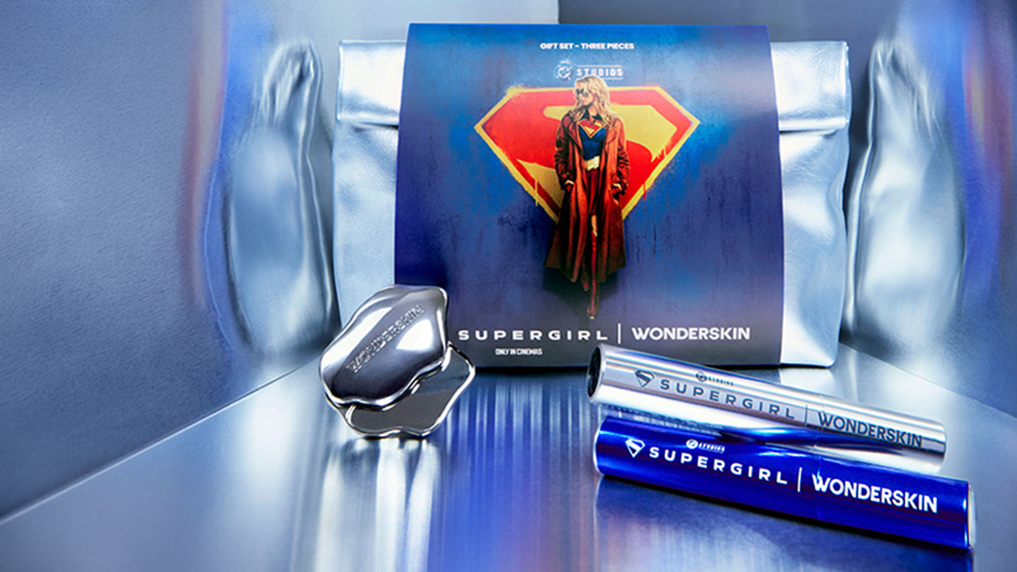 Supergirl limited edition beauty gift set with eye cream and mascara tubes displayed with branded box
