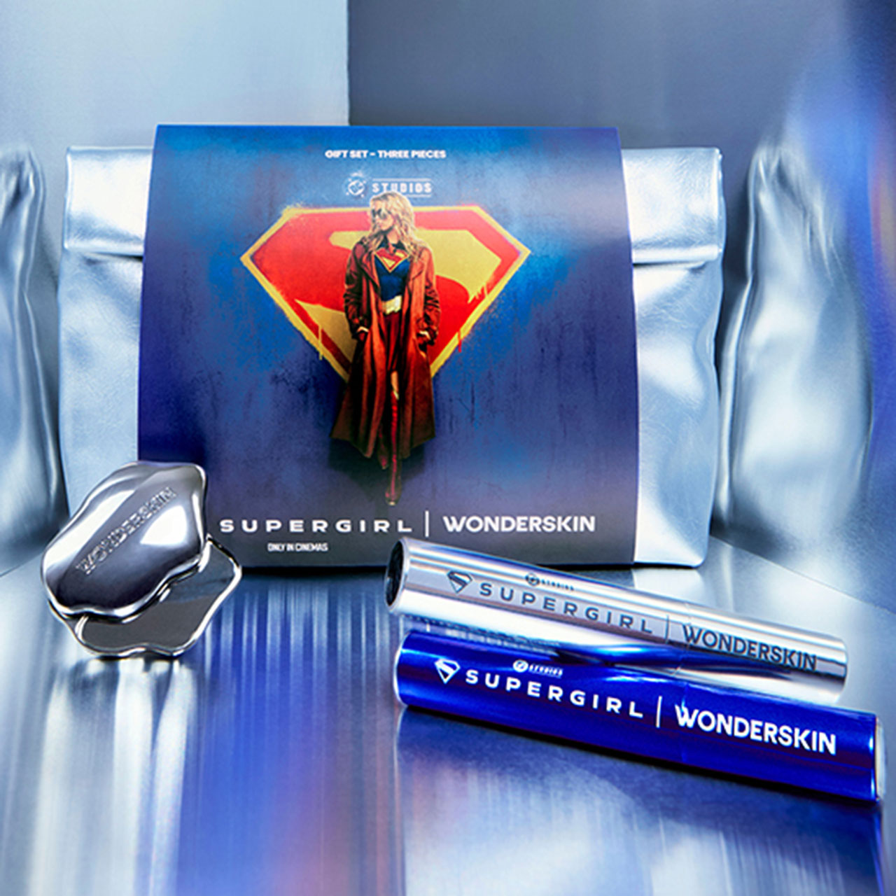 Supergirl limited edition beauty gift set with eye cream and mascara tubes displayed with branded box
