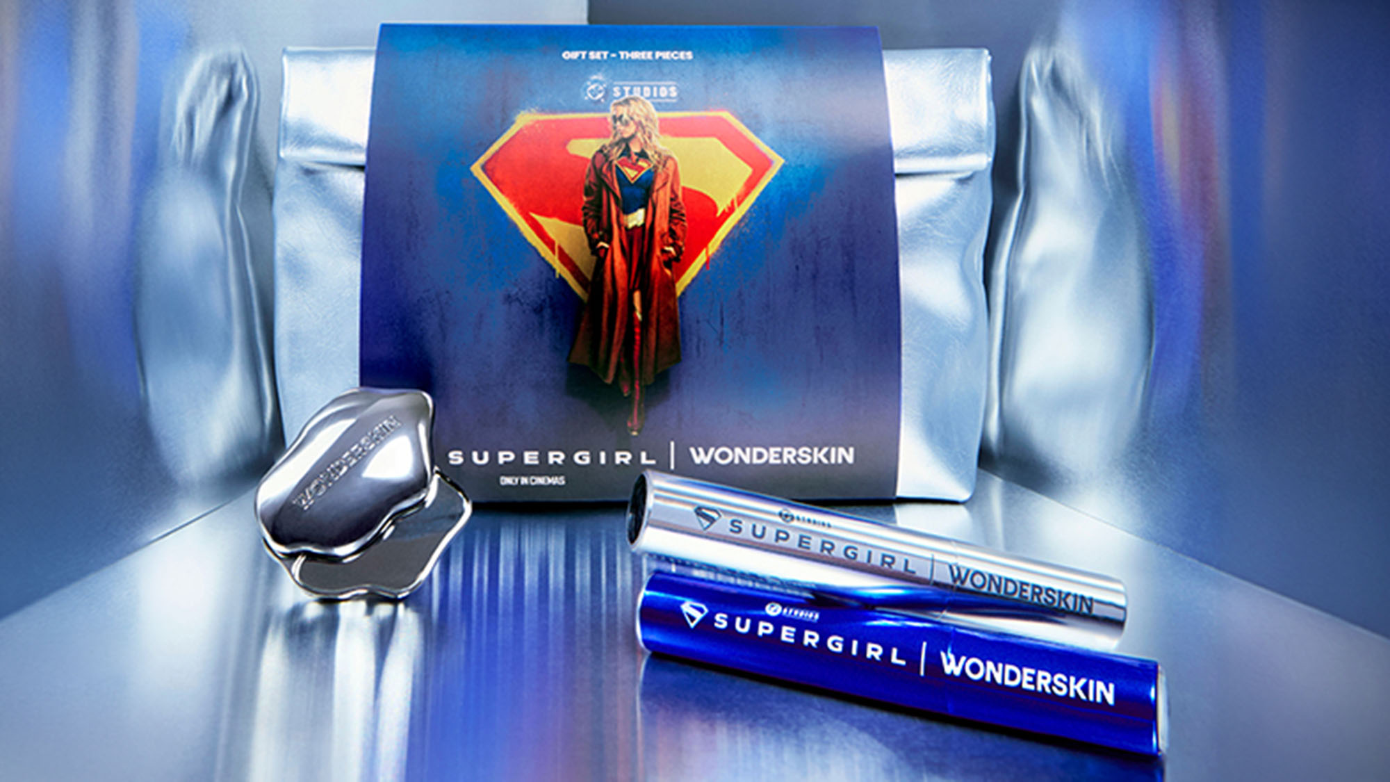 Supergirl limited edition beauty gift set with eye cream and mascara tubes displayed with branded box