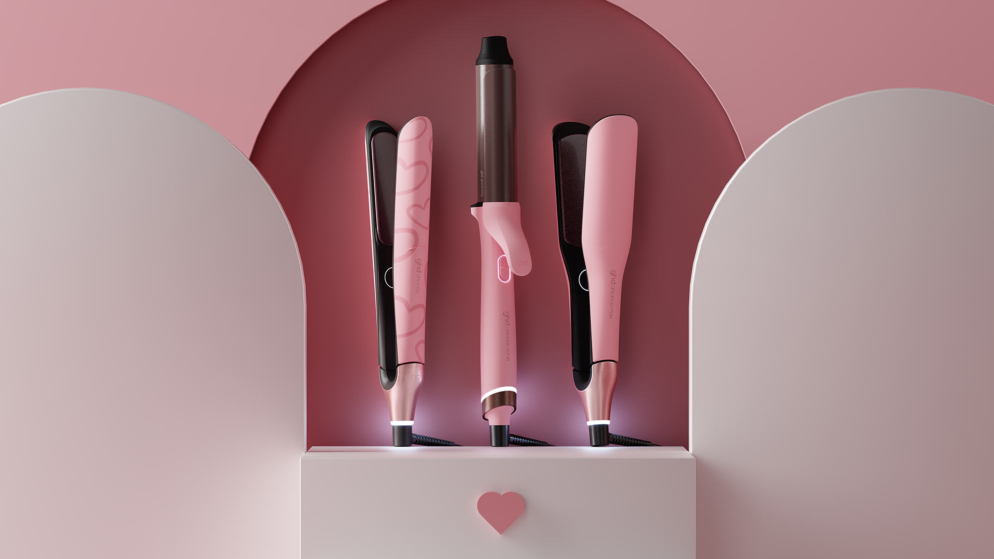 GHD Pink Collection hair tools including straighteners and curling irons in dusted pink finish displayed in white gift box