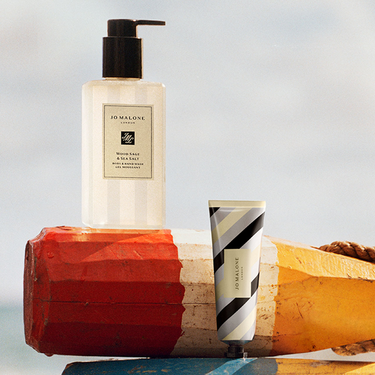 Jo Malone London Wood Sage & Sea Salt body and hand wash with hand cream displayed on coloured bricks