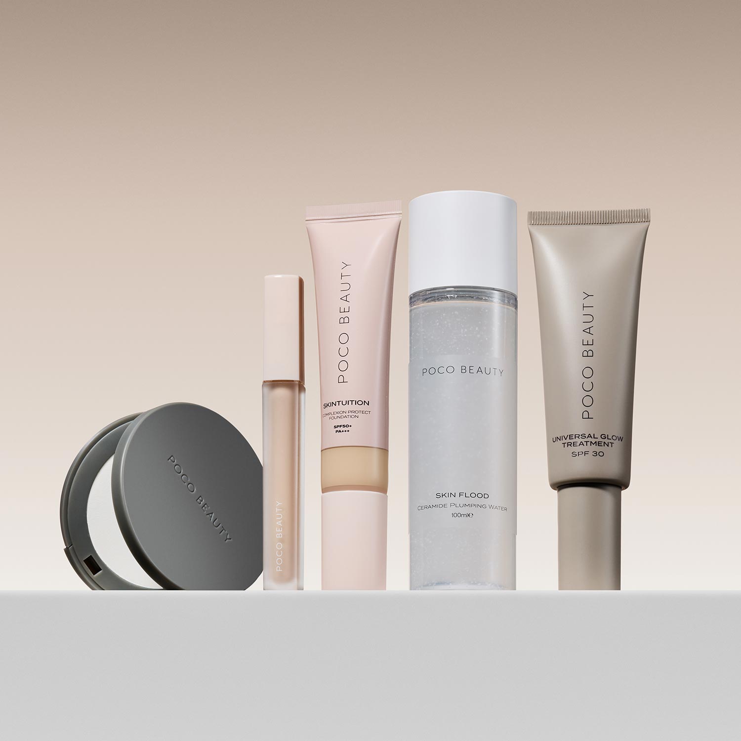 A set of Poco Beauty skincare and makeup products displayed on a smooth surface.