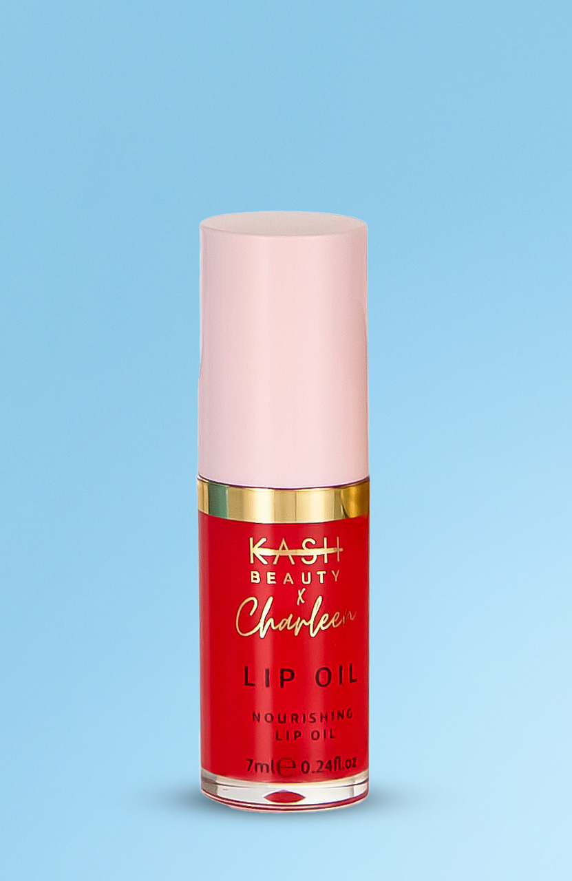 A red and pink tube of nourishing lip oil with gold accents on a blue background.