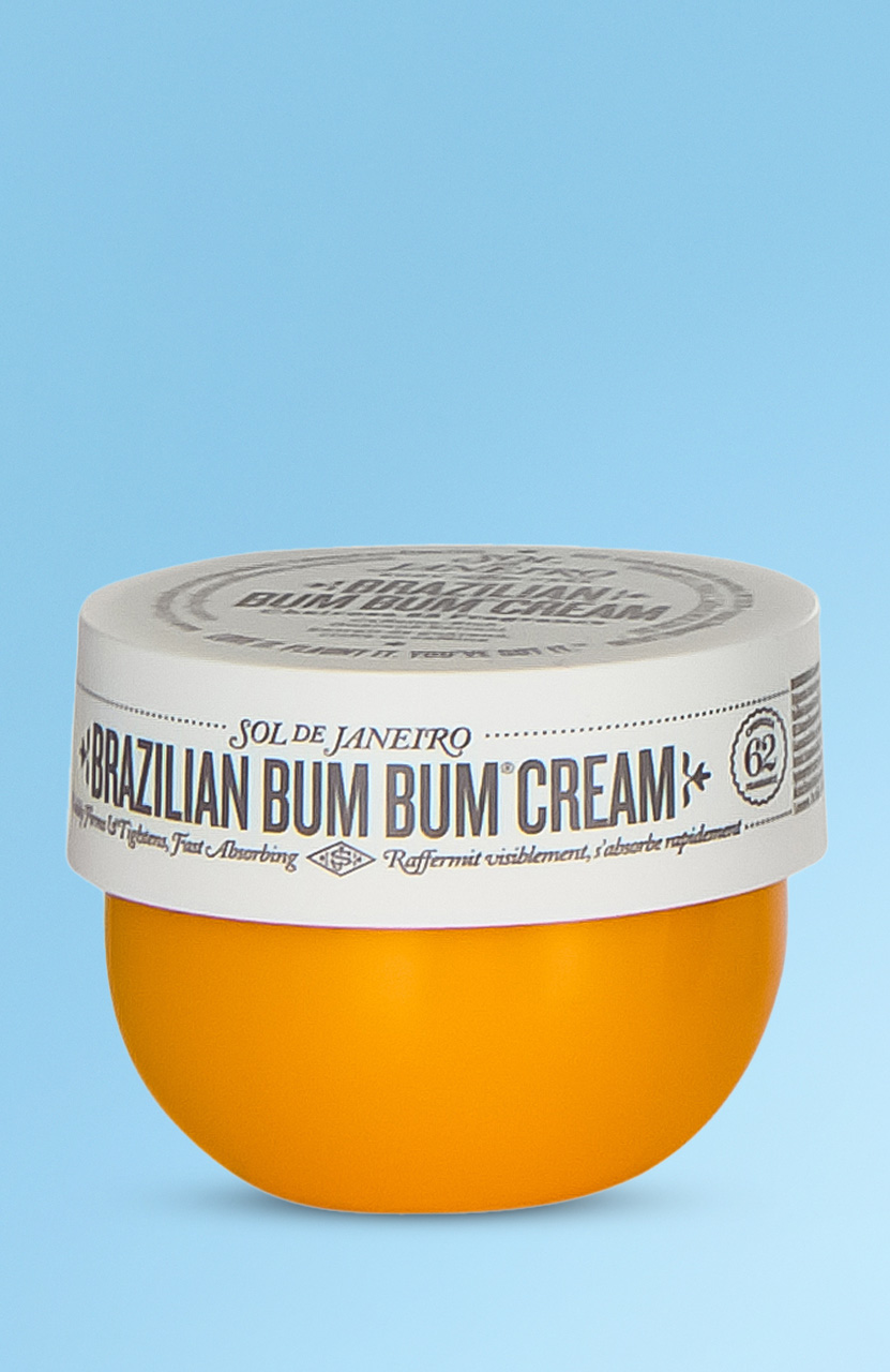 Orange and white jar of Sol de Janeiro Brazilian Bum Bum Cream on an blue background.