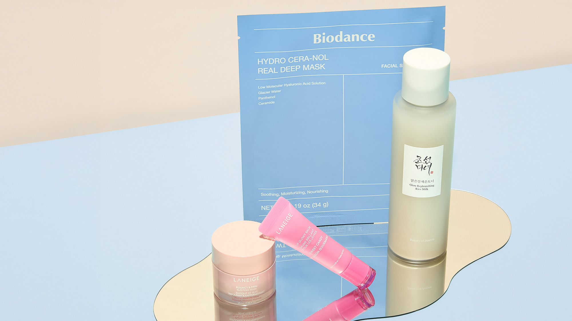 A variety of skincare and beauty products arranged on a light beige background.