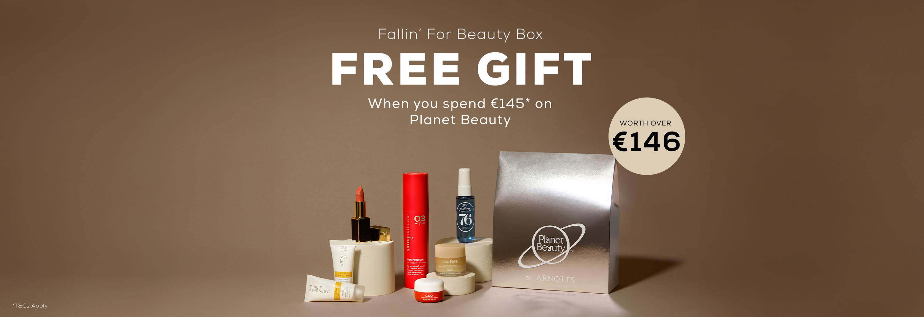 Assorted beauty products displayed with text offering a free gift for spending on beauty items.