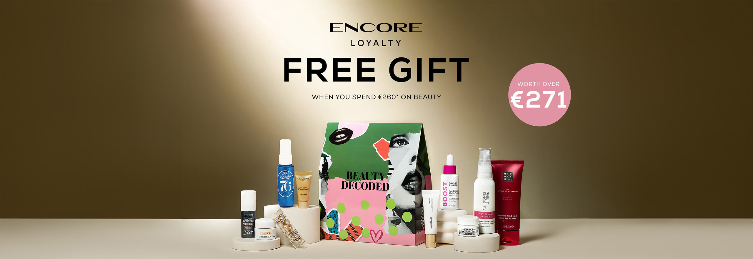 Assorted beauty products displayed with text offering a free gift for spending on beauty items.