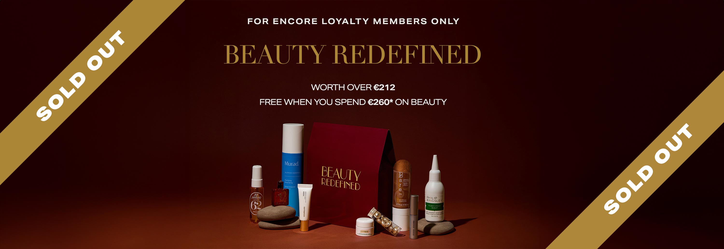 Assorted beauty products displayed with text offering a free gift for spending on beauty items.