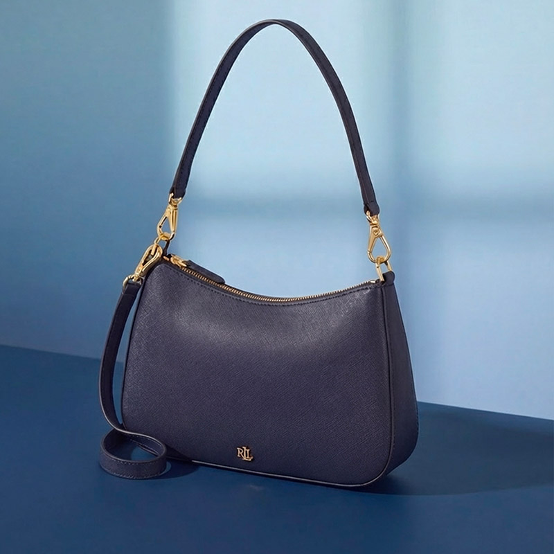 A sleek black leather handbag with gold accents and a shoulder strap, set against a blue background.