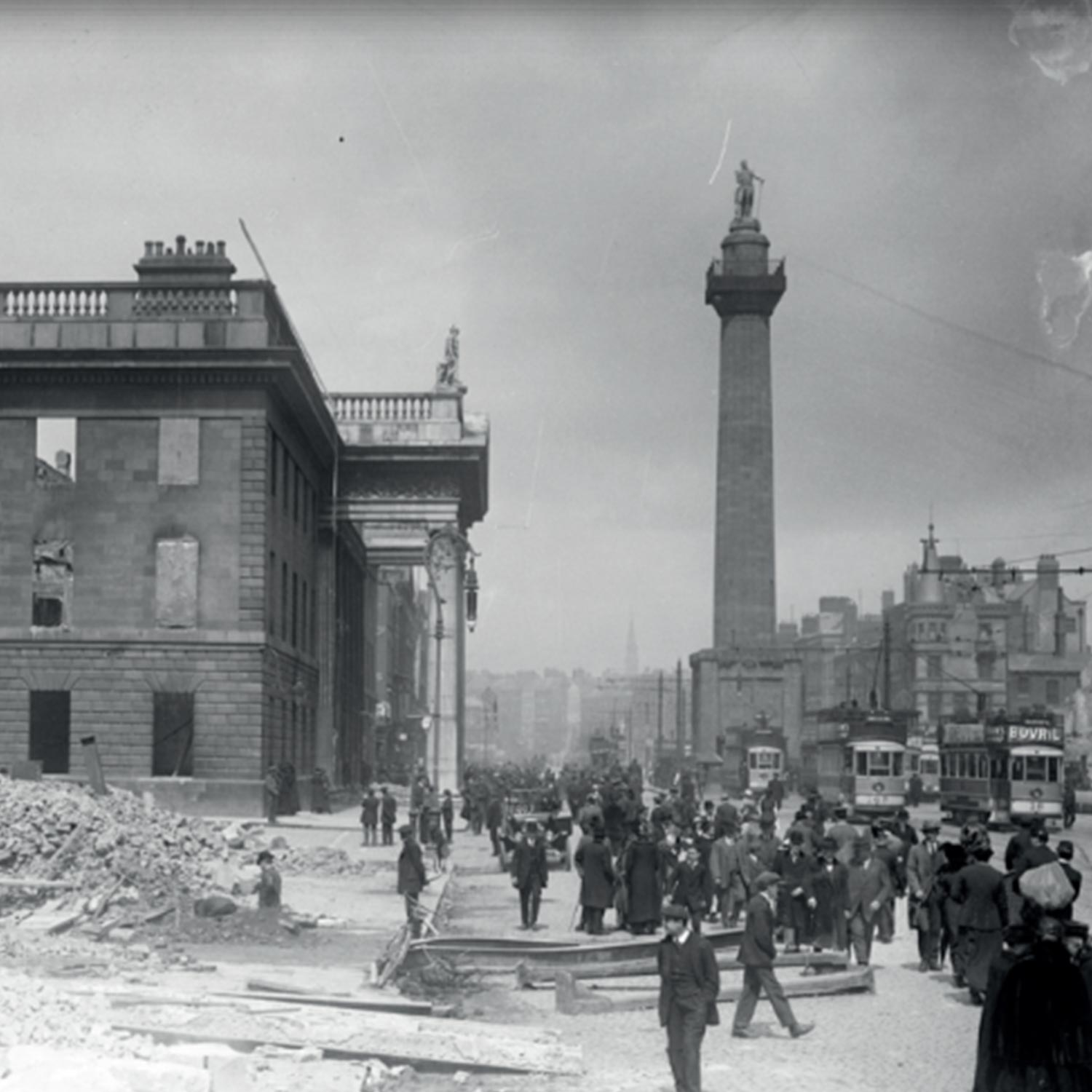 Black and white photograph of Dublin street scene with crowds, tram, and damaged building following the 1894 fire disaster