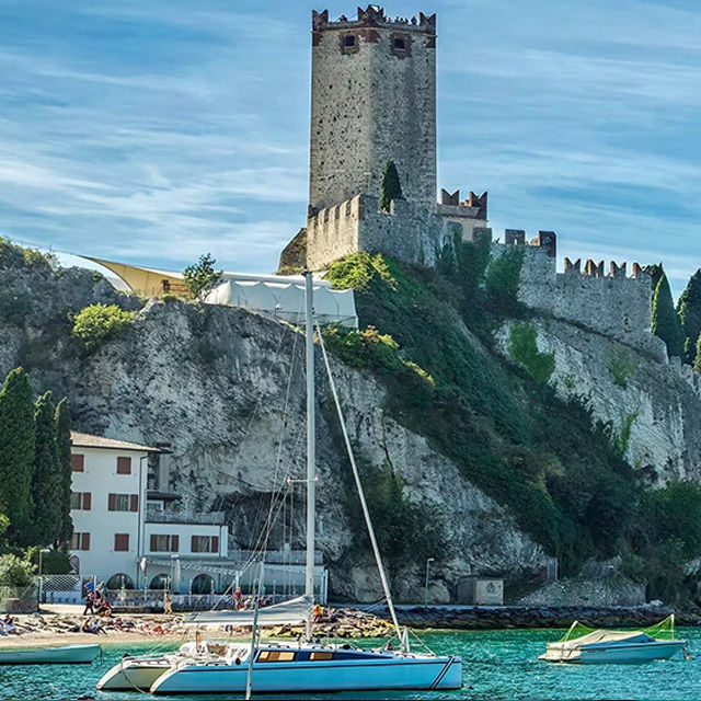 boat next to an old castle