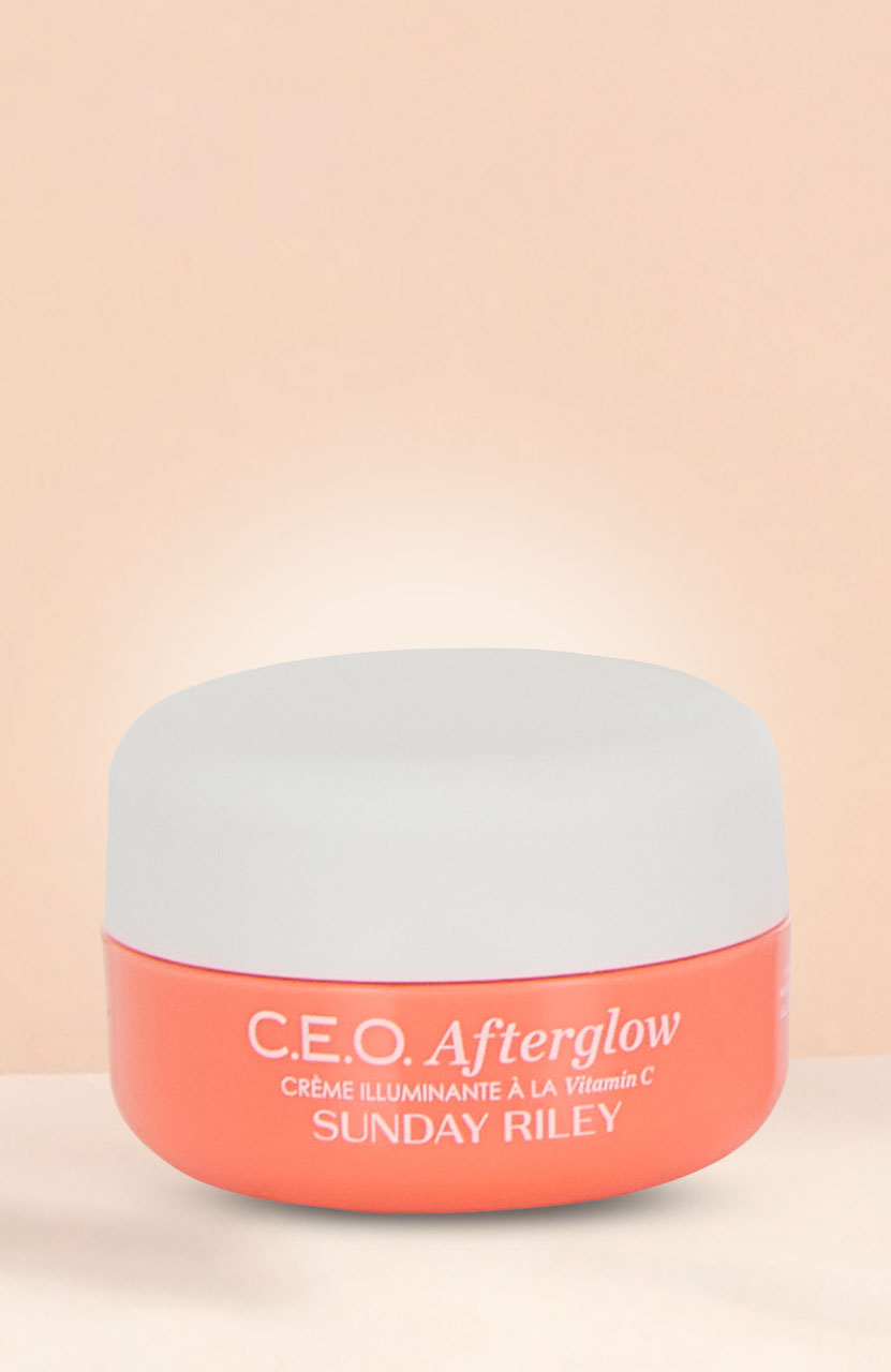 A white tube of Philip Kingsley Bond Builder split end remedy against a peach background.