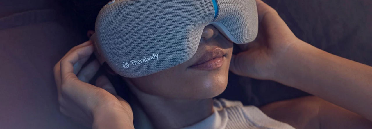 Woman using Therabody headset