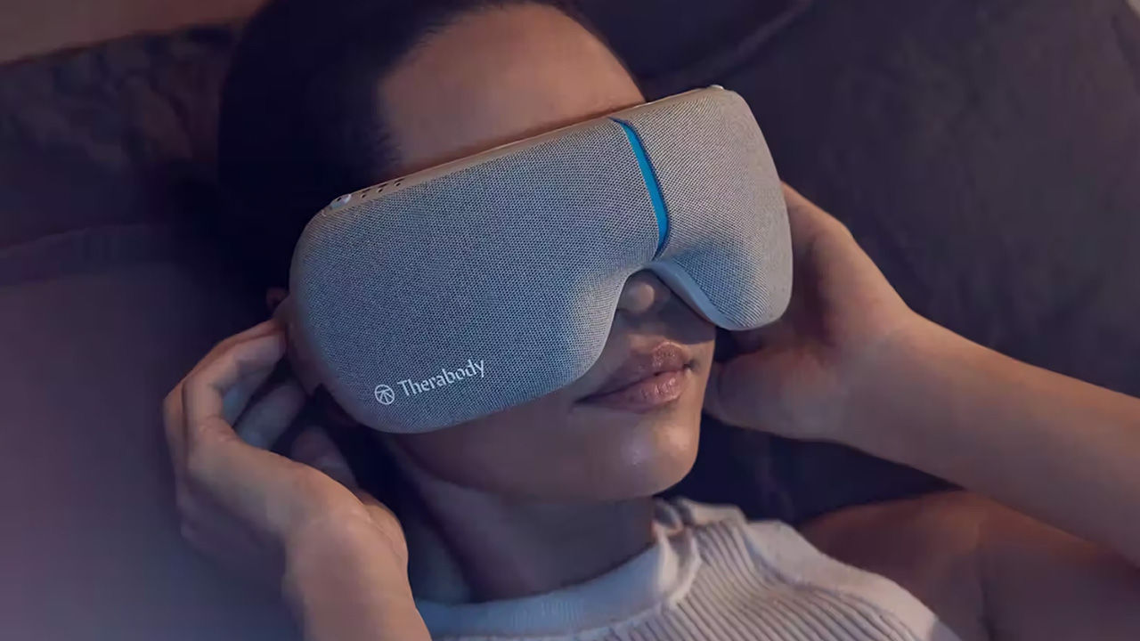 woman wearing Therabody headset