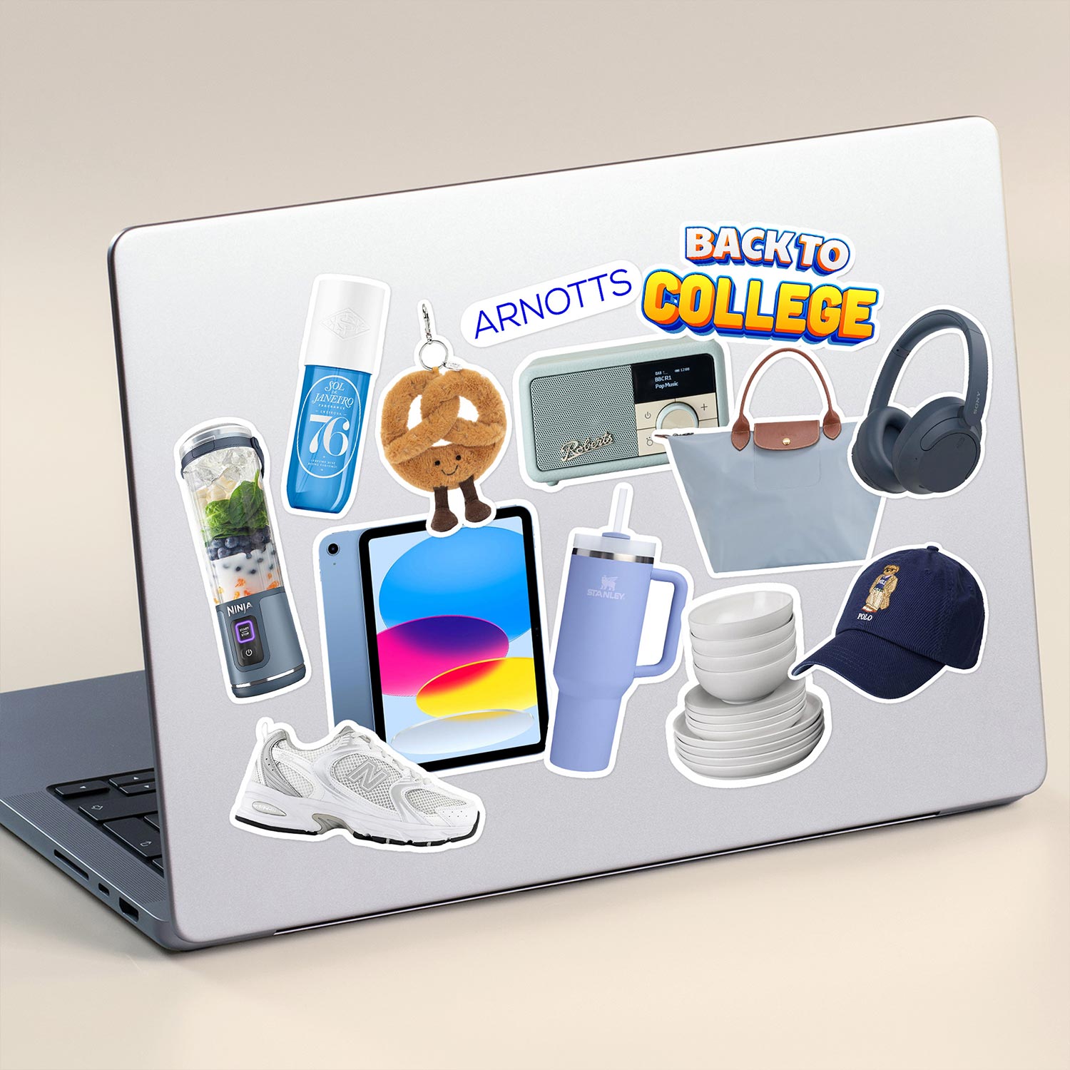 laptop with stickers on saying back to college