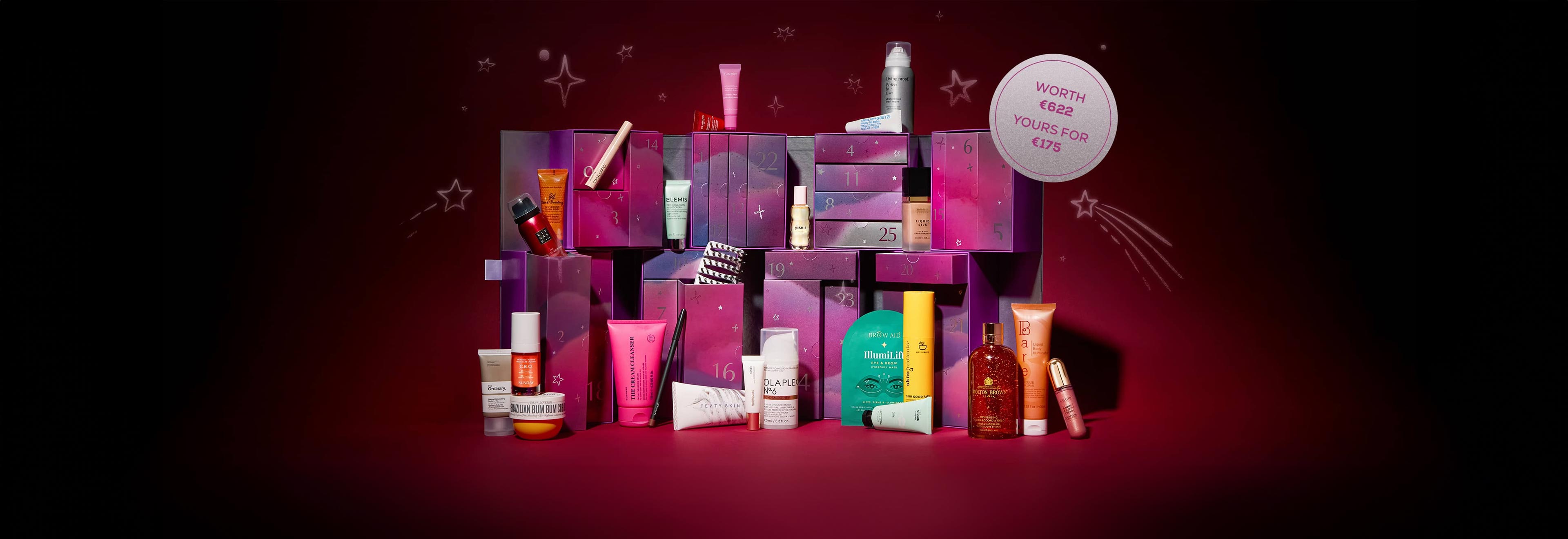Assorted beauty and skincare products displayed against a starry, purple backdrop with boxes and a “Worth €622 Yours For €150 label.
