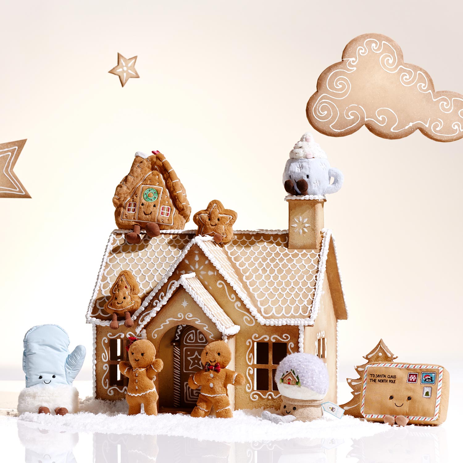 A gingerbread house surrounded by cookie figures, stars, and clouds in a whimsical winter scene.