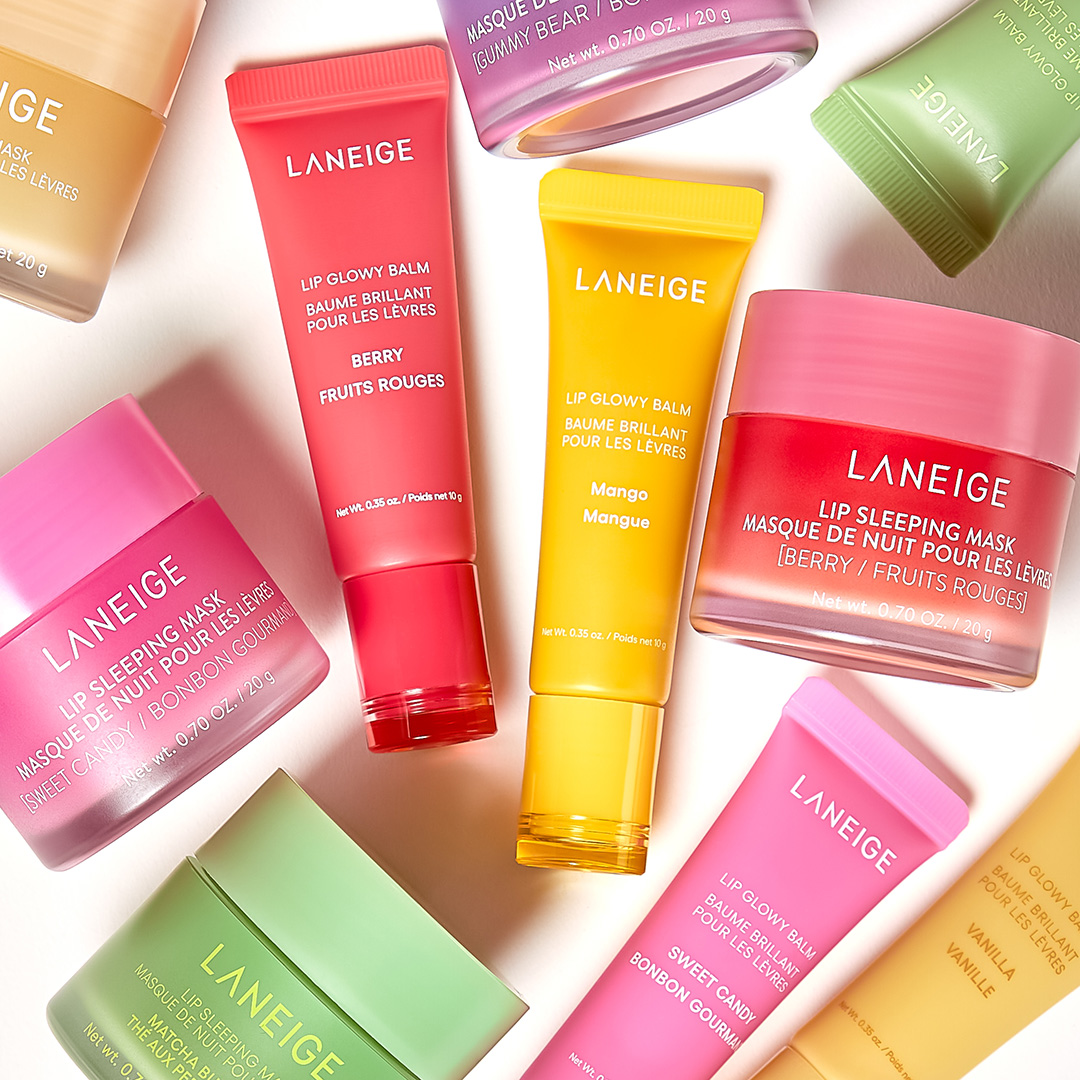 A variety of Laneige lip care products, including lip balms and sleeping masks, in colorful packaging.