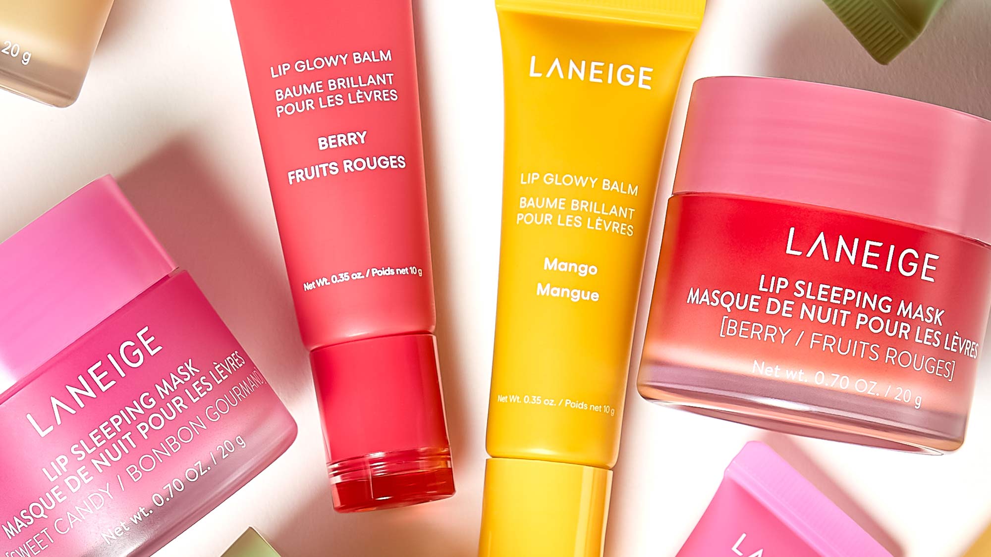 A variety of Laneige lip care products, including lip balms and sleeping masks, in colorful packaging.