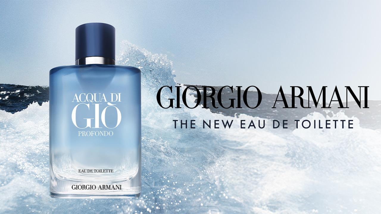 Perfume bottle of Acqua di Giò Profondo by Giorgio Armani, set against an ocean wave background.
