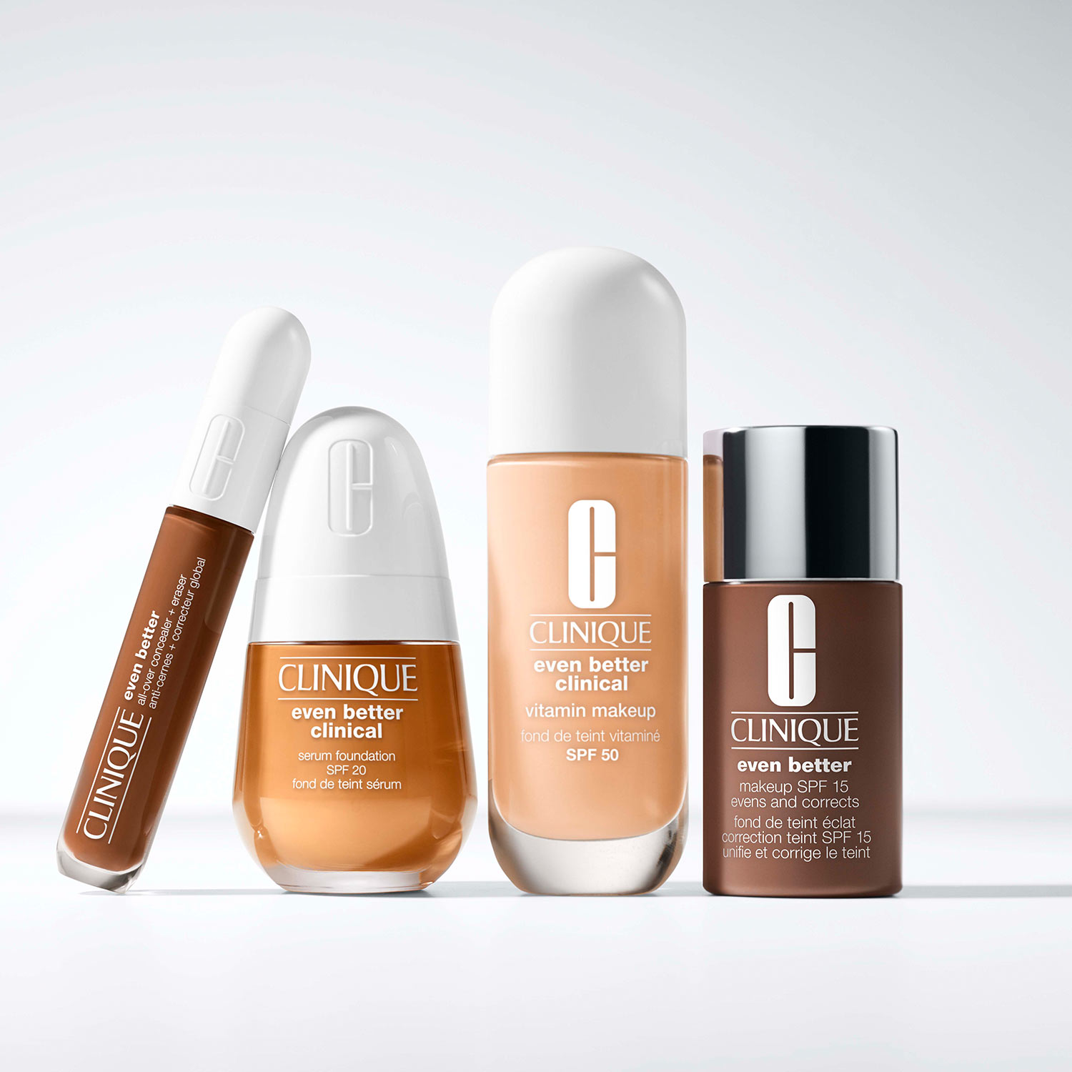Four Clinique skincare products in varying shades aligned on a white surface.