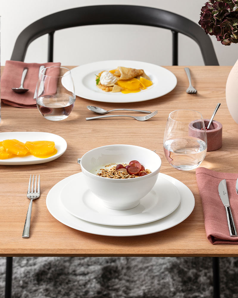 dinnerware white on wooden kitchen table set for two
