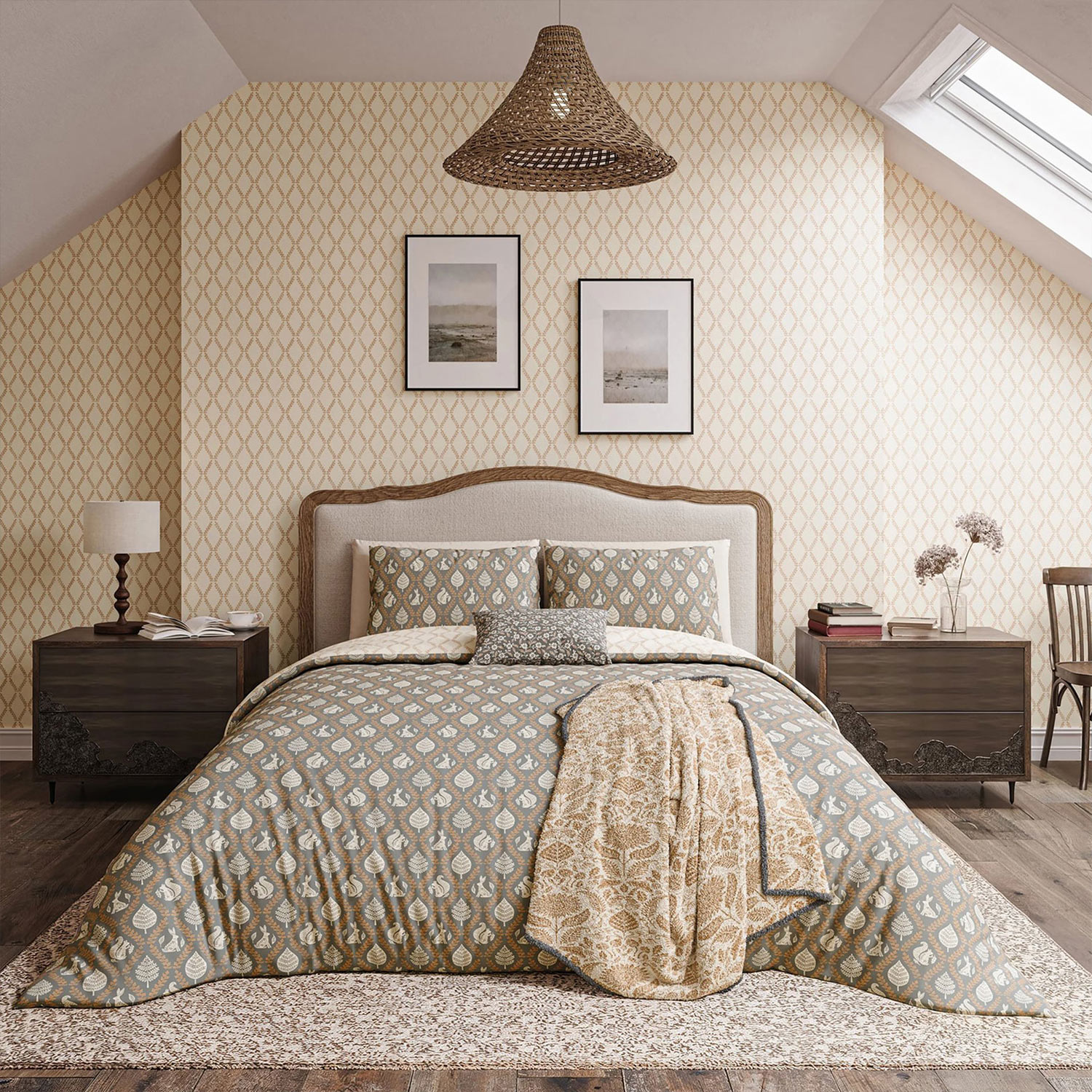 Cozy bedroom with patterned bedding, two framed pictures, bedside tables, and a sloped ceiling with a skylight. Warm, neutral tones throughout.