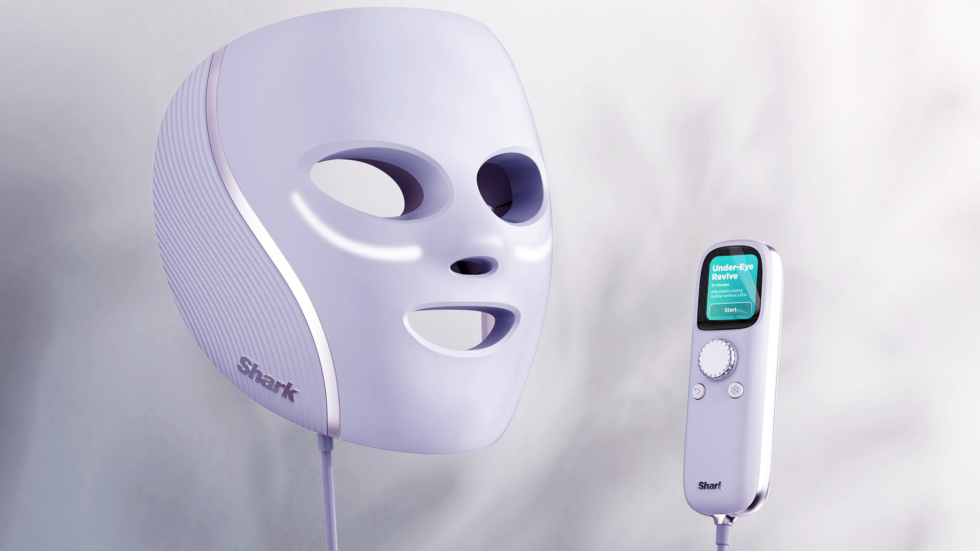 A white LED facial mask with a remote control, both marked 'Shark,' on a misty background.