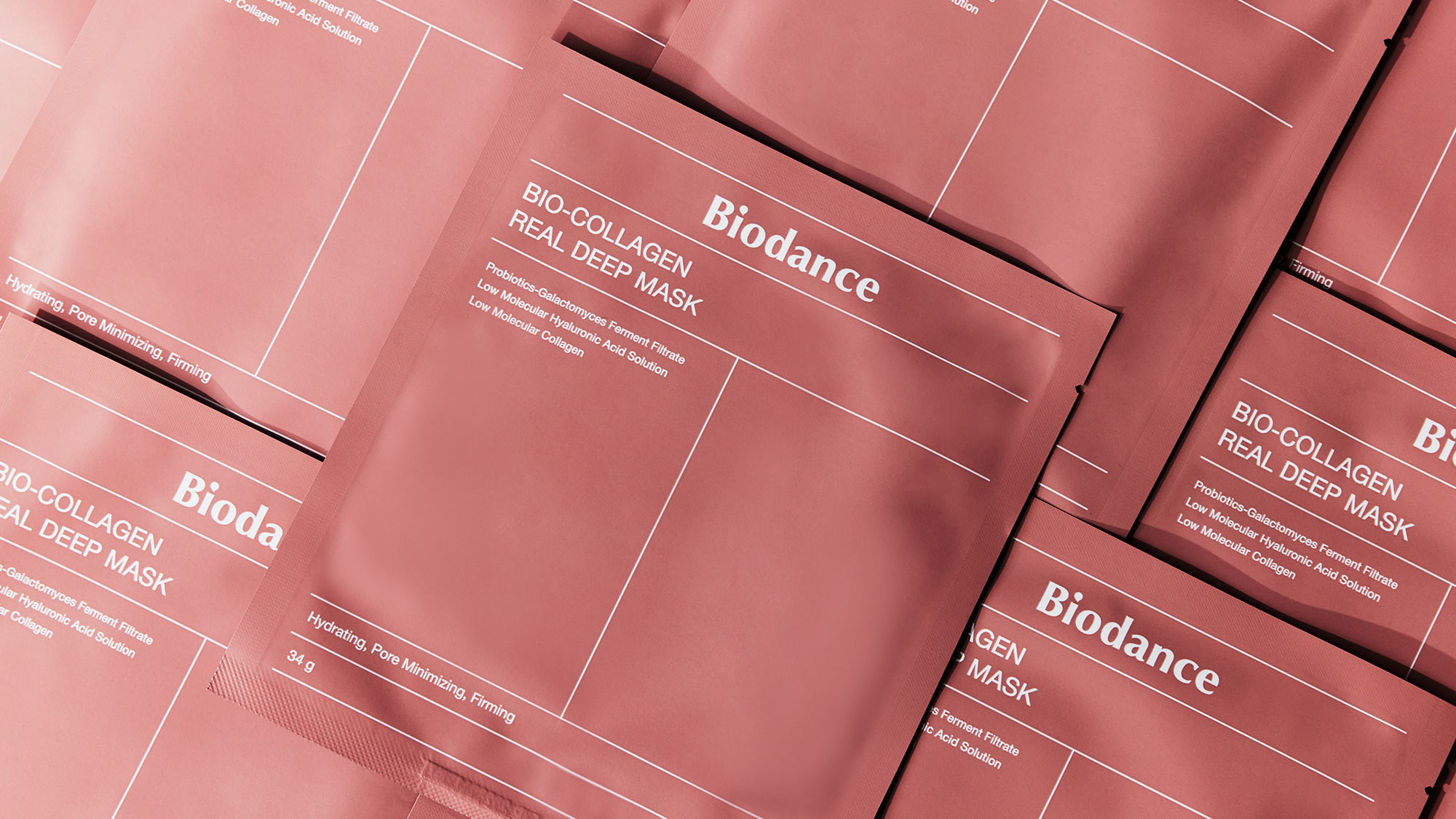 Pink packets of Biodance Bio-Collagen Real Deep Masks arranged in a pattern.