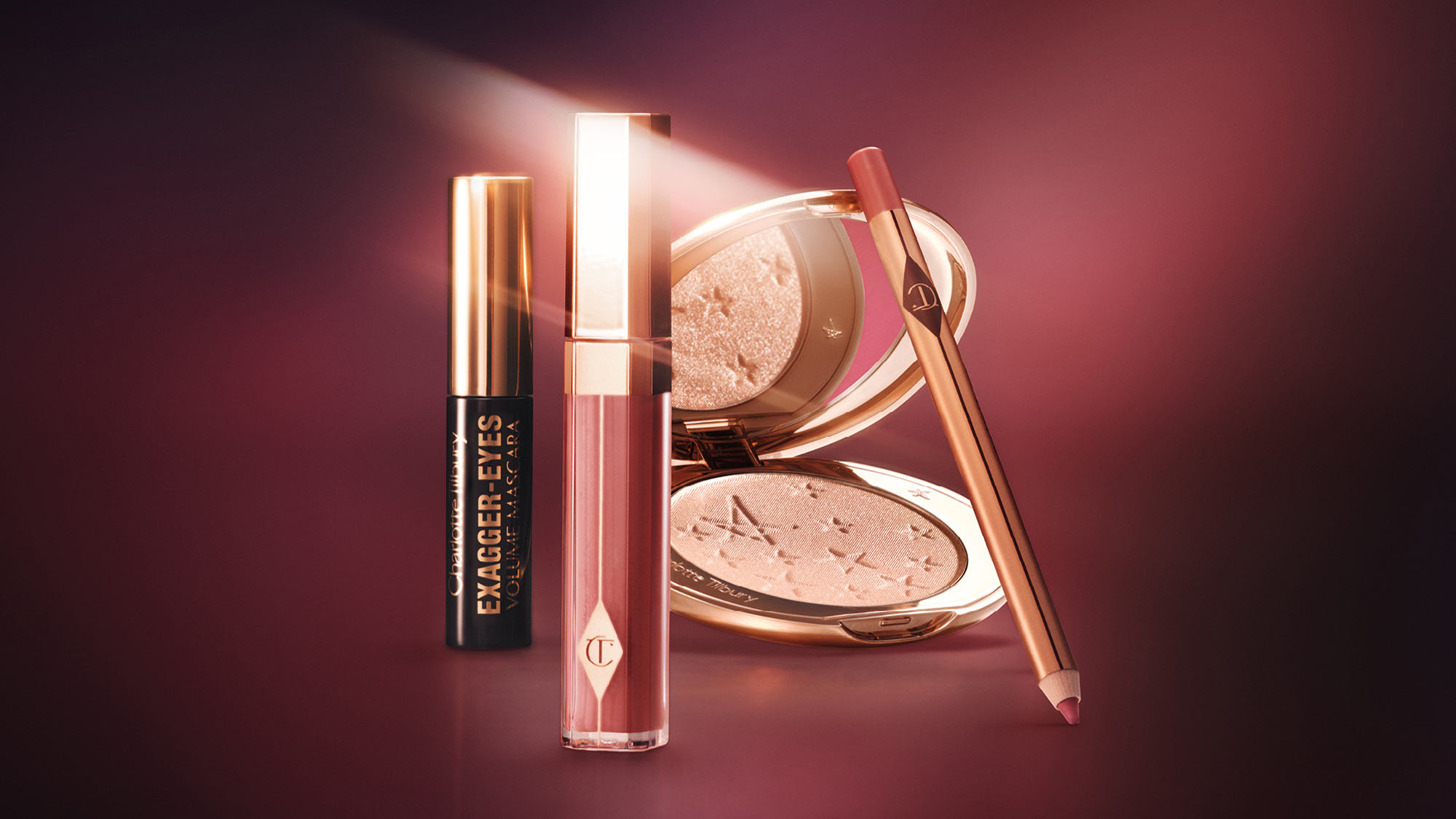 Makeup set featuring mascara, lip gloss, pencil, and powder compact on a gradient background.