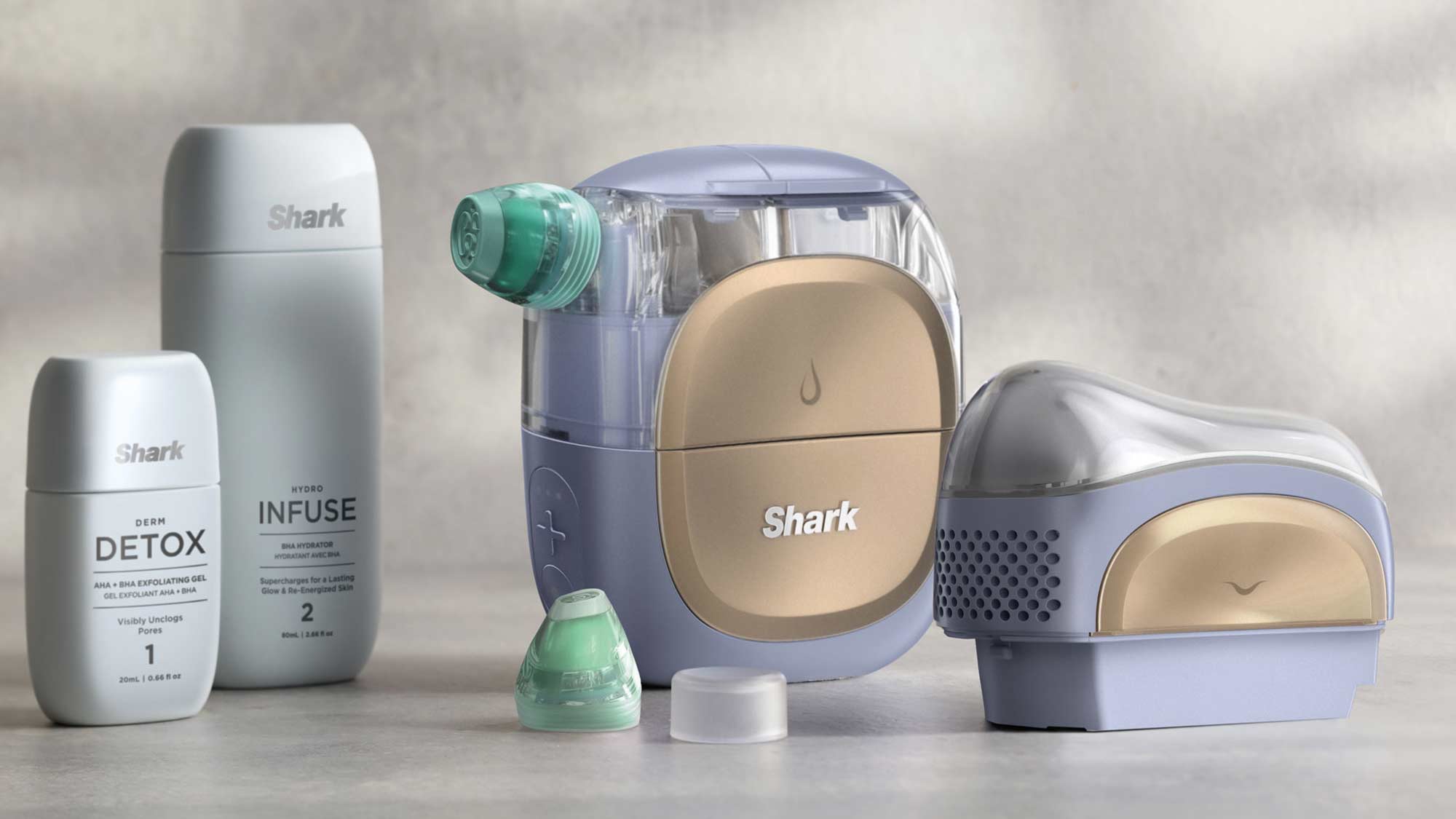 A collection of Shark cleaning products includes bottles and a device with an attachable brush head on a light background.
