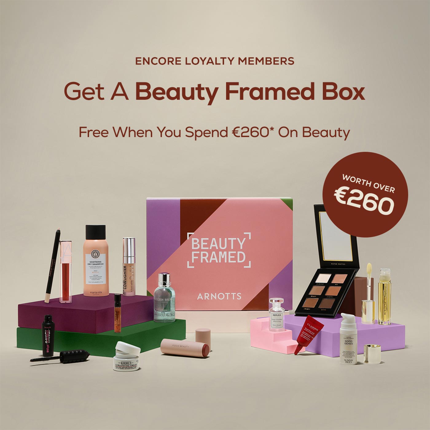 Beauty Framed Box promotion featuring cosmetics and skincare products arranged on coloured blocks, worth over €260