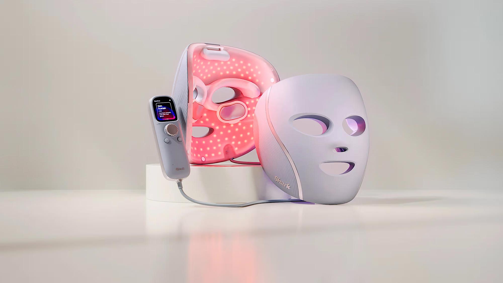 LED light therapy facial mask and handheld skin treatment device with digital display and control panel