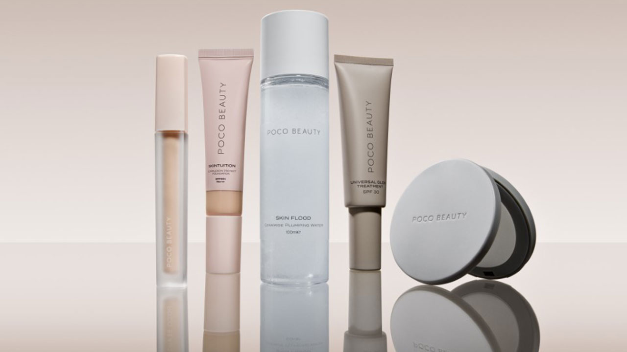 A collection of Poco Beauty skincare products, including serum, cream, and toner, are displayed on a reflective surface.