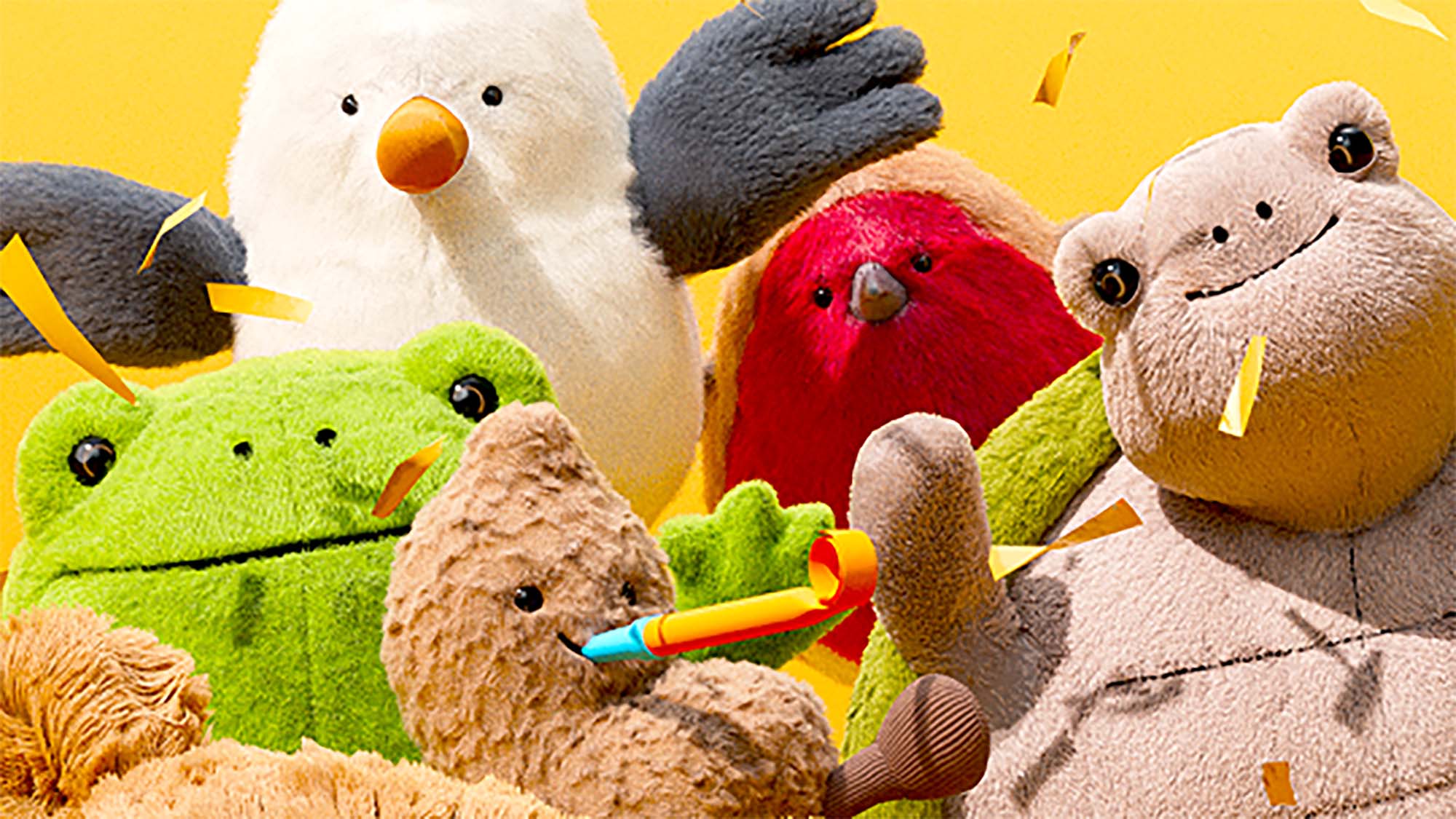 A group of colorful, plush animal toys, including a bear, bunny, frog, and bird, against a bright yellow background with confetti.