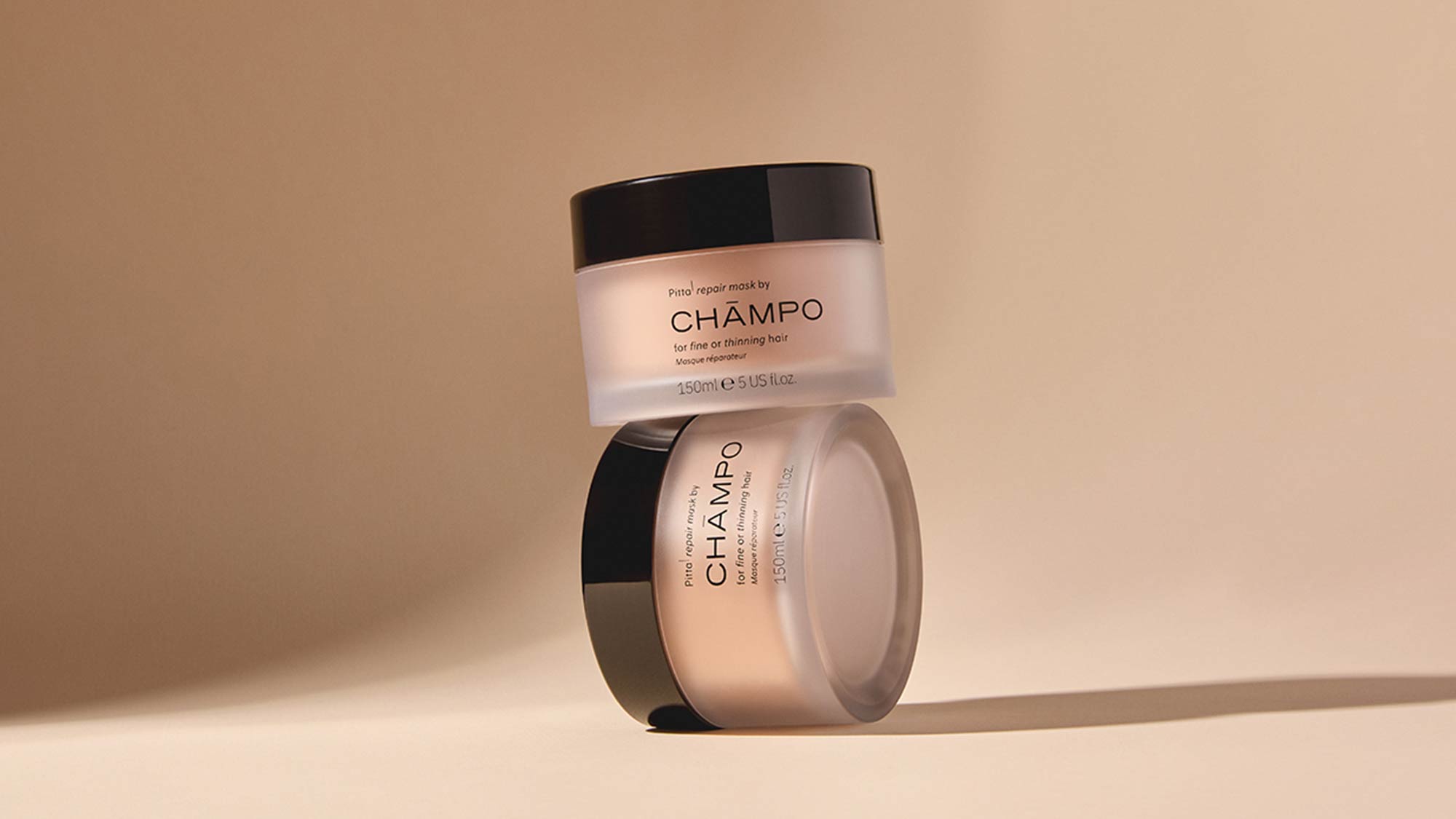 Two Champo Pitta repair mask containers for fine and thinning hair on neutral beige background