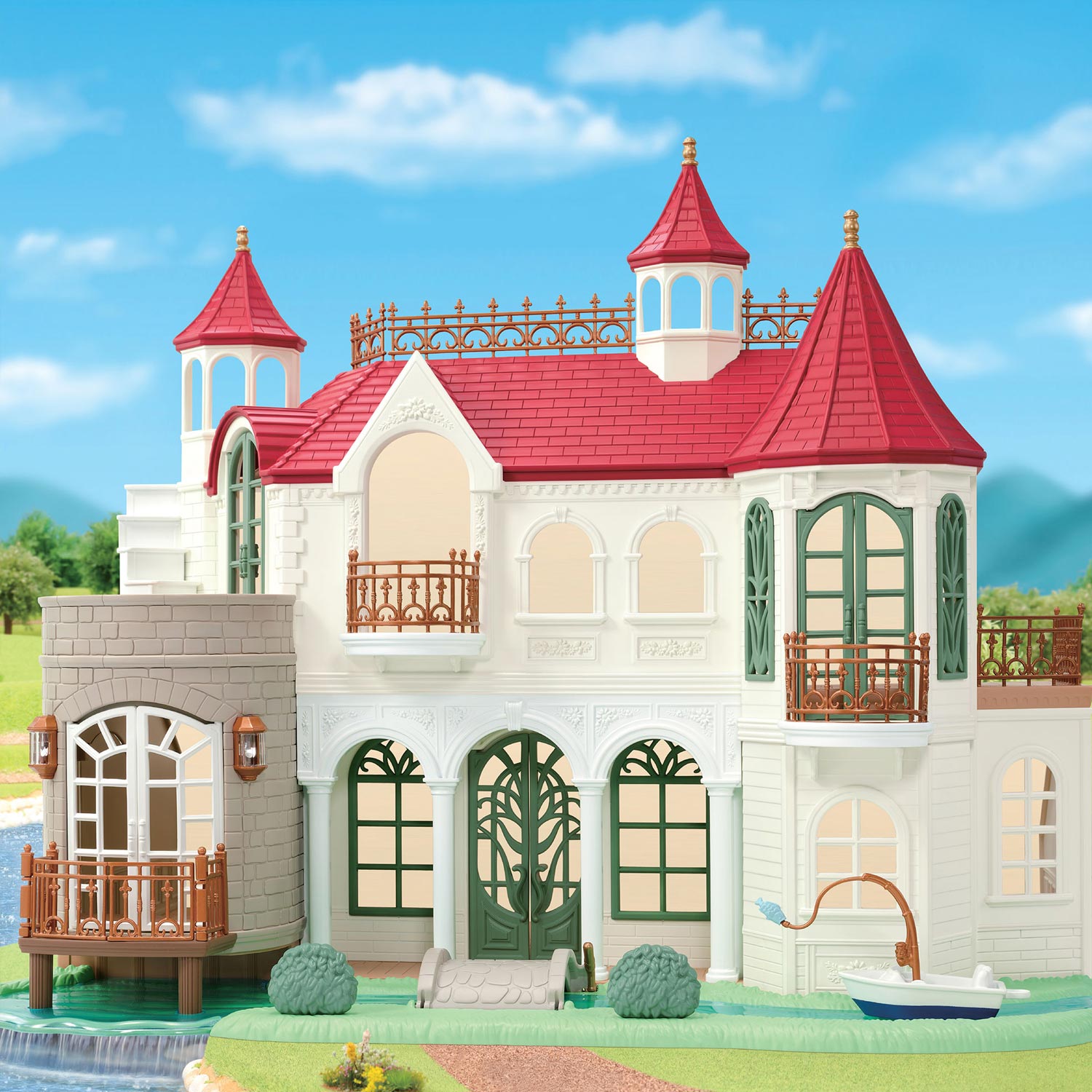 Sylvanian Families grand Victorian mansion with red turrets, white walls, green doors and waterside setting