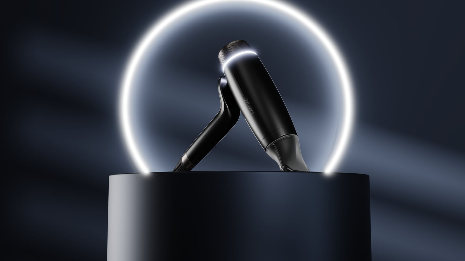 A sleek black wireless earbud set is displayed on a dark pedestal with a glowing circle in the background.